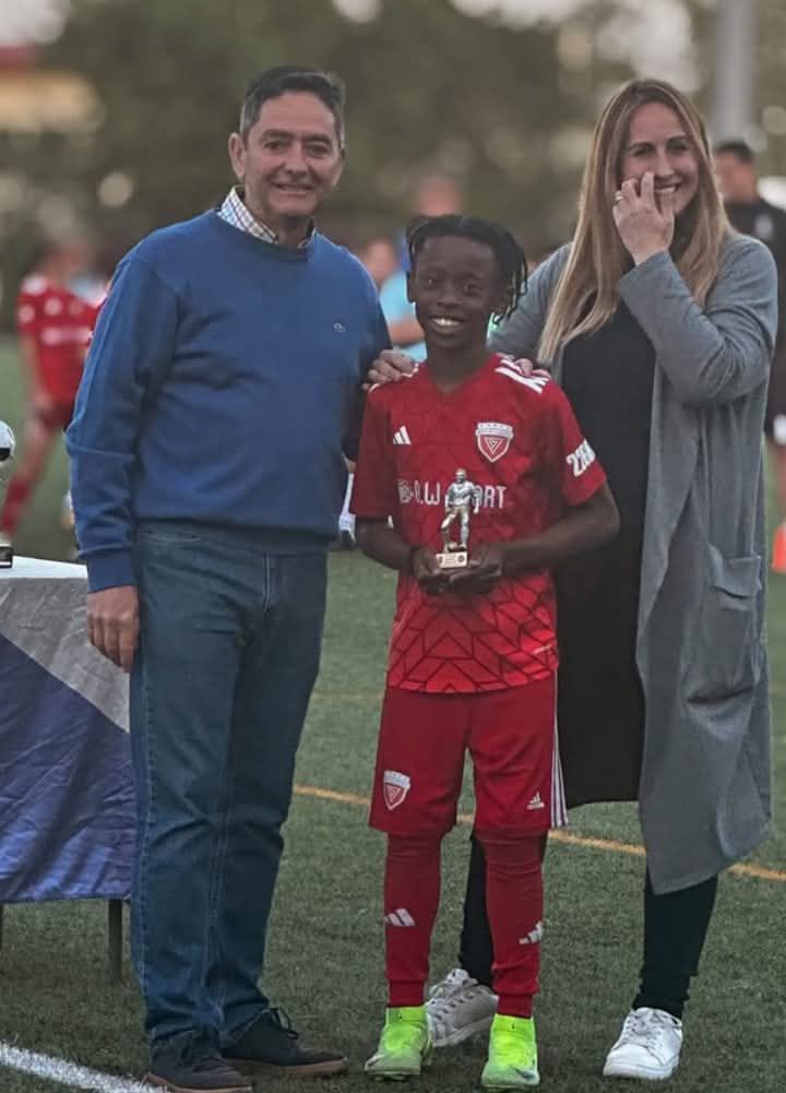 Celio Camavinga getting recognition as top scorer in a juvenile A competition in Madrid district.